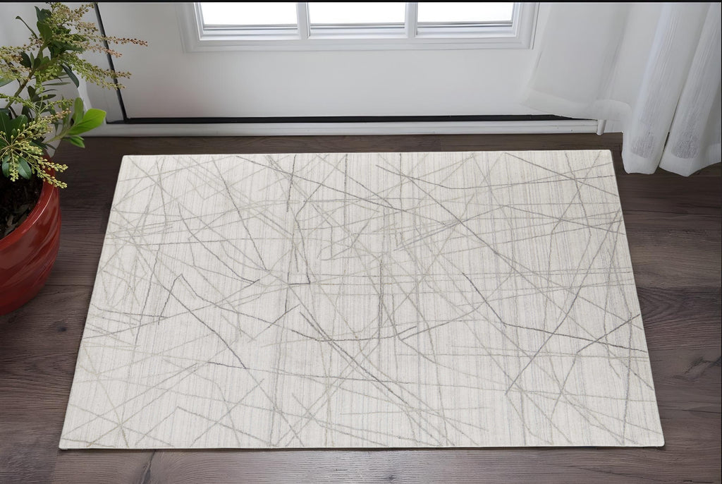 2' X 3' Gray and Ivory Abstract Hand Woven Area Rug